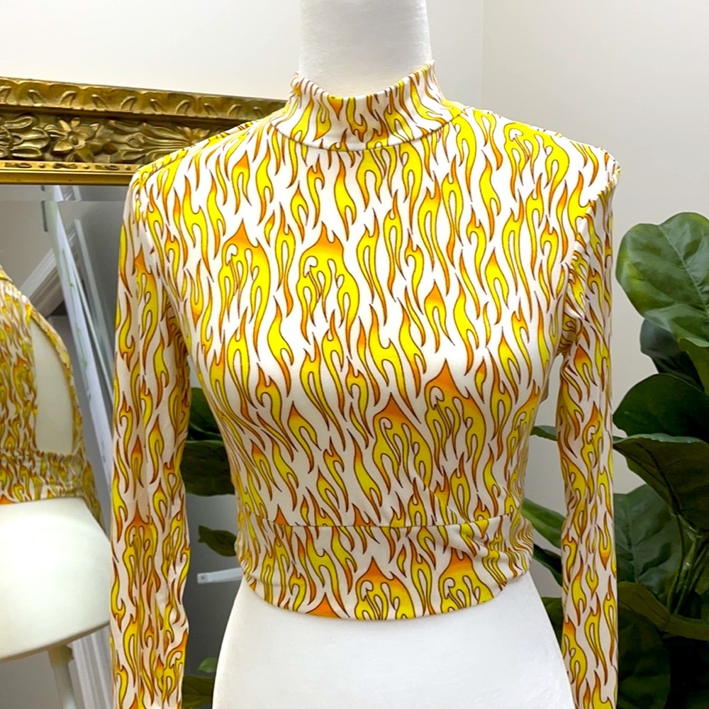 Flame pattern long sleeve cut out bodycon crop top in a soft spandex blend